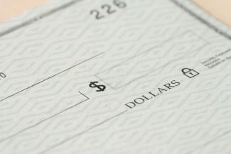 a cheque by Money Knack courtesy of Unsplash.