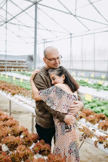 man hugging woman inside garden house by Anthony Tran courtesy of Unsplash.