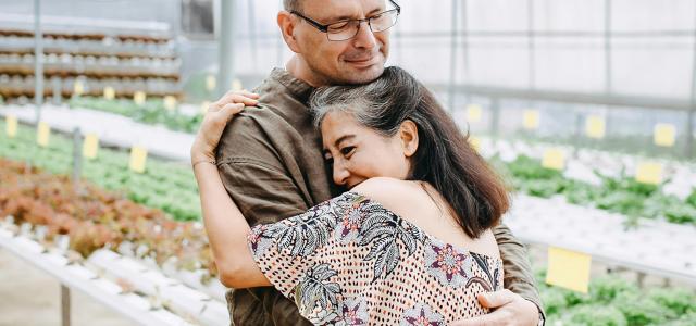 man hugging woman inside garden house by Anthony Tran courtesy of Unsplash.